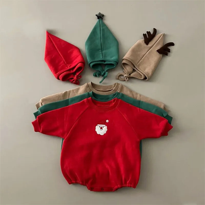 Adorable newborn in a festive red Santa romper with white trim and matching hat, cotton blend.