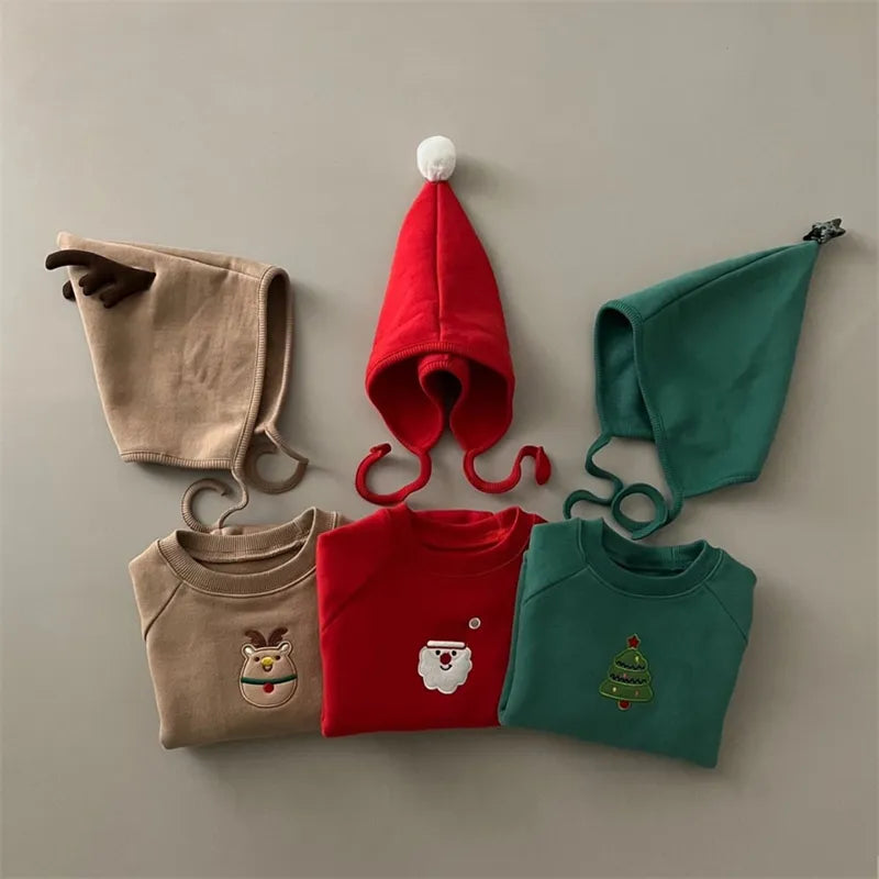 Toddler in a cute red Santa romper with full sleeves and hat, perfect Christmas sweater outfit.