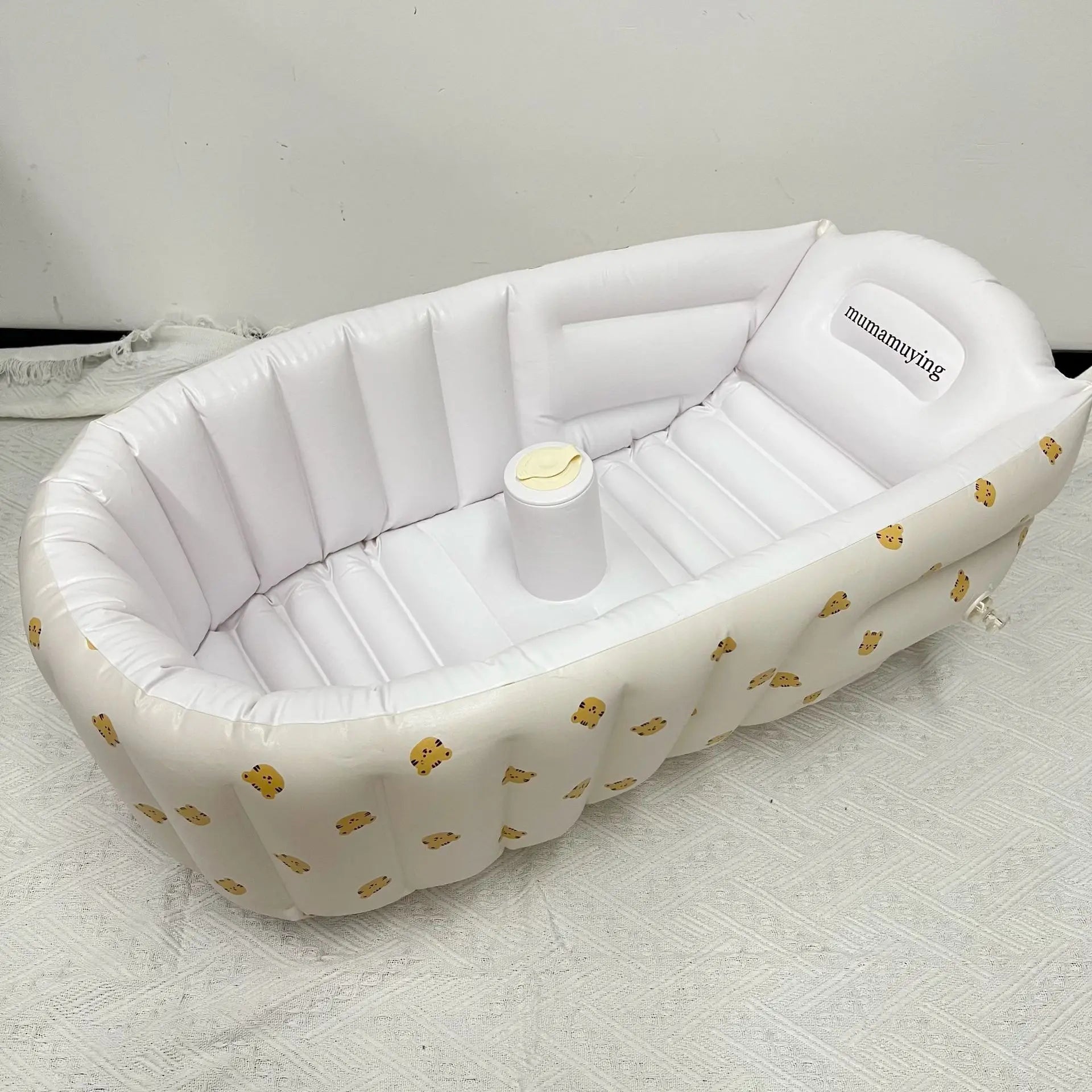 Durable, BPA-free inflatable baby bathtub with a whimsical animal print, perfect for eco-friendly parents
