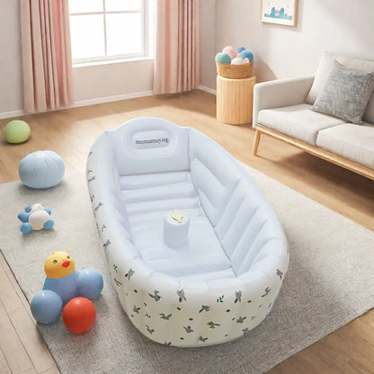 Portable eco-friendly inflatable baby bathtub featuring a cute penguin design for safe bathing
