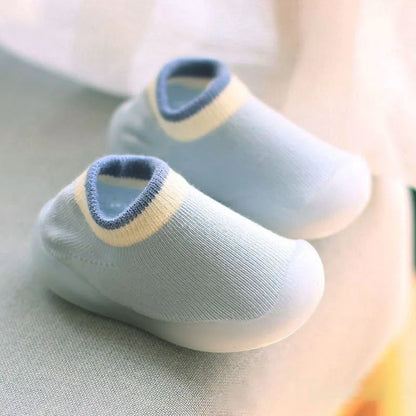 Close-up of soft knit baby boots, flexible sole for comfortable first steps