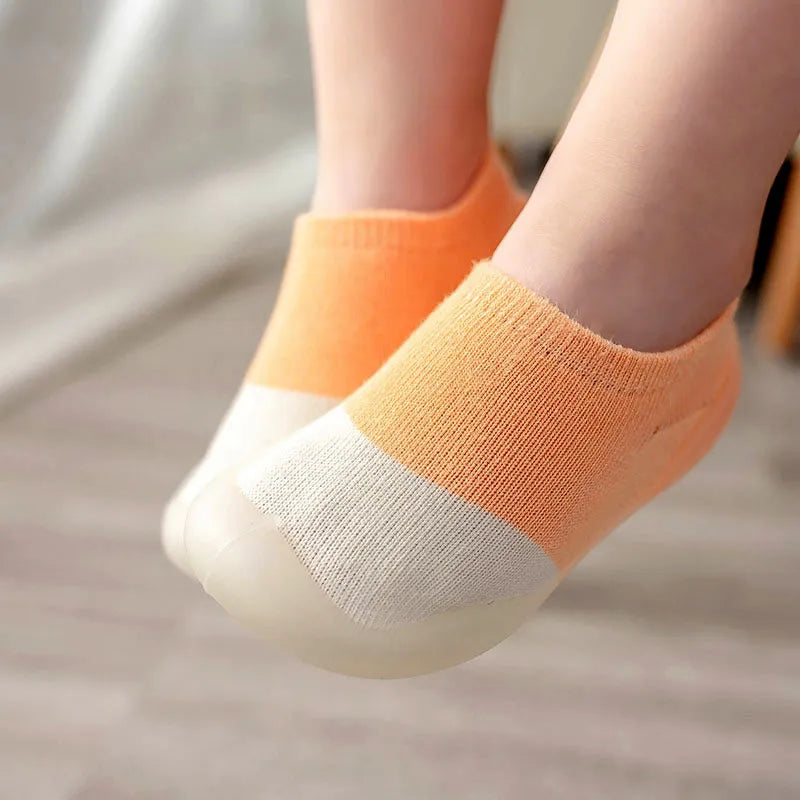 A range of knit first walker boots for baby, in soft neutral tones
