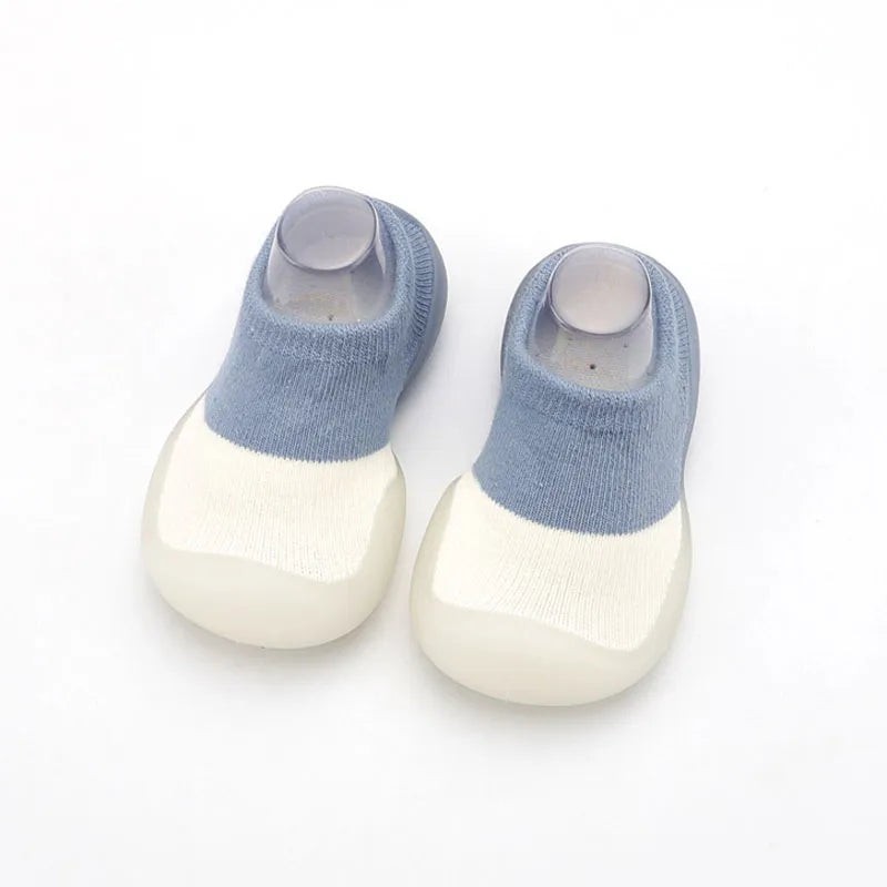 Close-up of the delicate stitching on unisex knit baby shoes