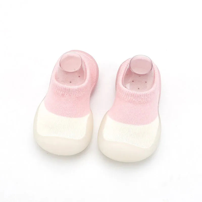 Baby crawling in soft and flexible knit walking boots