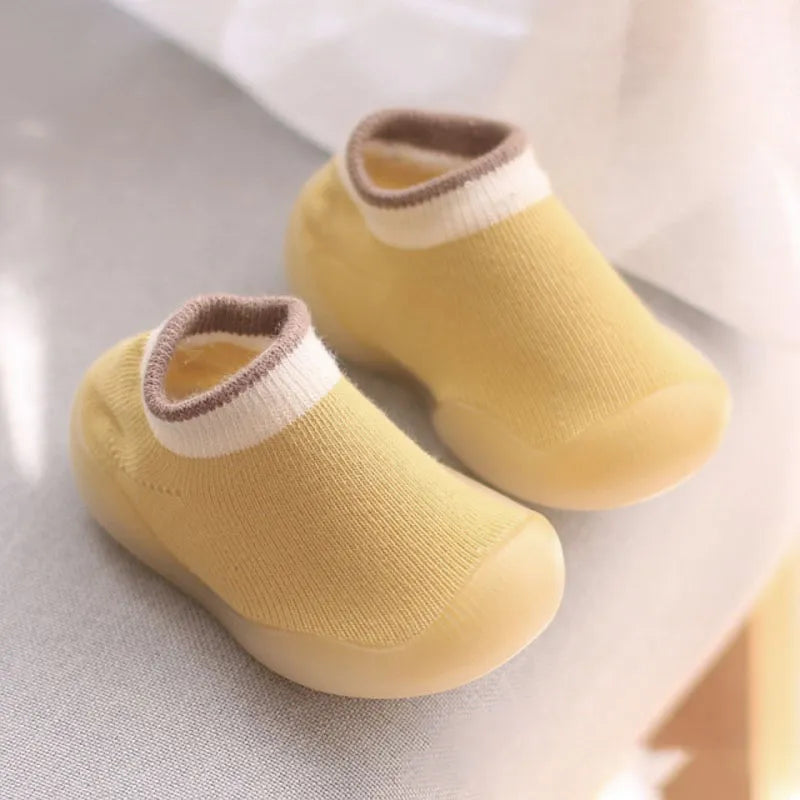 Infant first steps in soft grey knit walking boots, unisex design