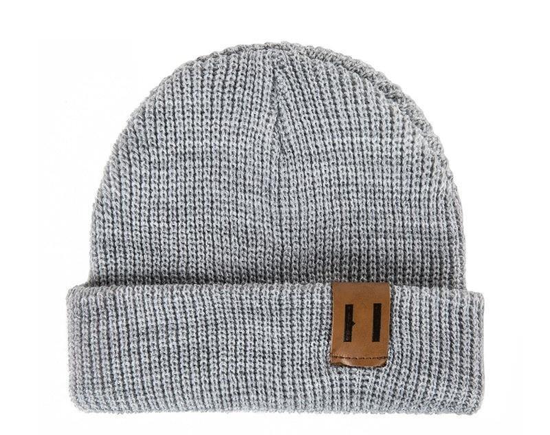 Close-up of a knitted baby hat, unisex design, warm crochet beanie for cold weather
