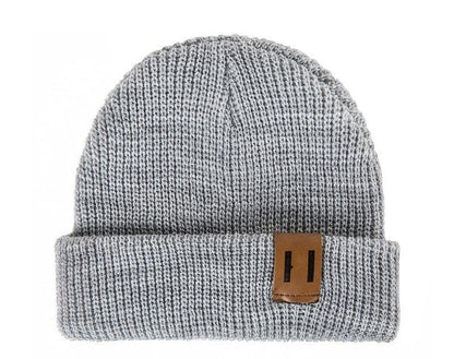 Close-up of a knitted baby hat, unisex design, warm crochet beanie for cold weather