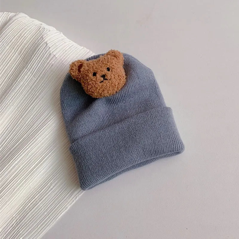 Comfortable infant knitted beanie hat, featuring a playful bear ear design for winter