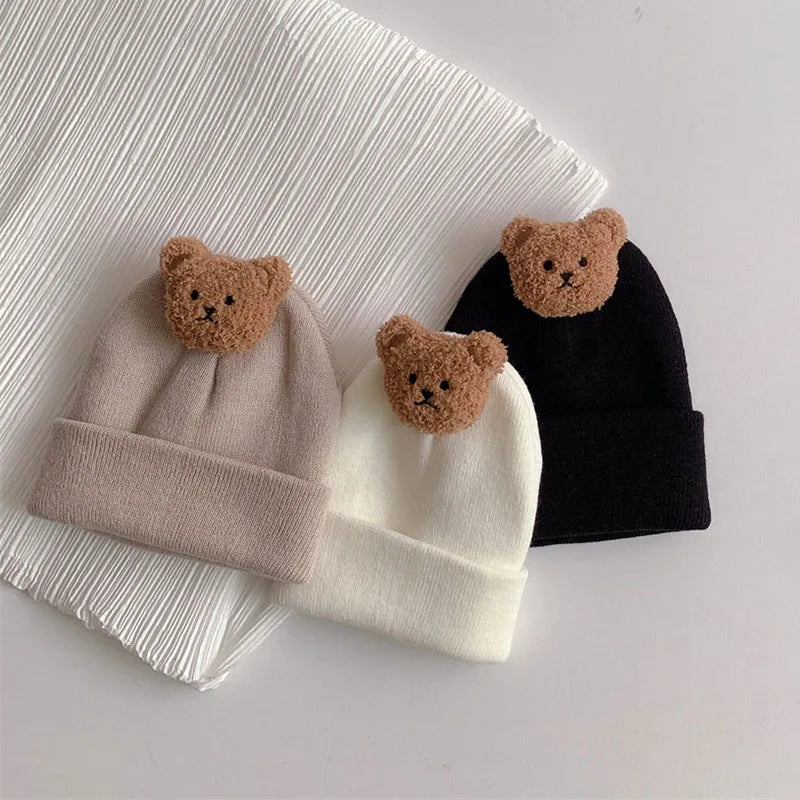 Detailed shot of the bear ear knitting on a warm baby hat, a cozy winter accessory