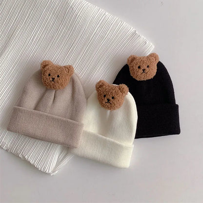 Detailed shot of the bear ear knitting on a warm baby hat, a cozy winter accessory