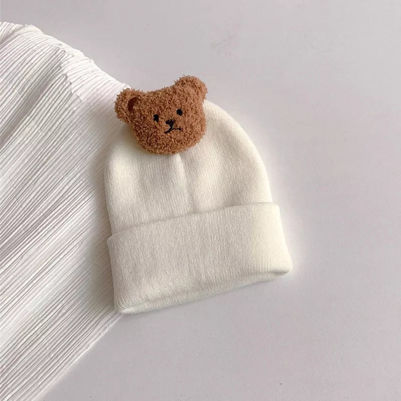 Baby accessories: a warm, knitted bear hat designed for comfort and style in winter
