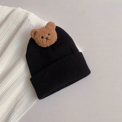 View of a knitted winter hat with bear ears, excellent for baby's outdoor adventures
