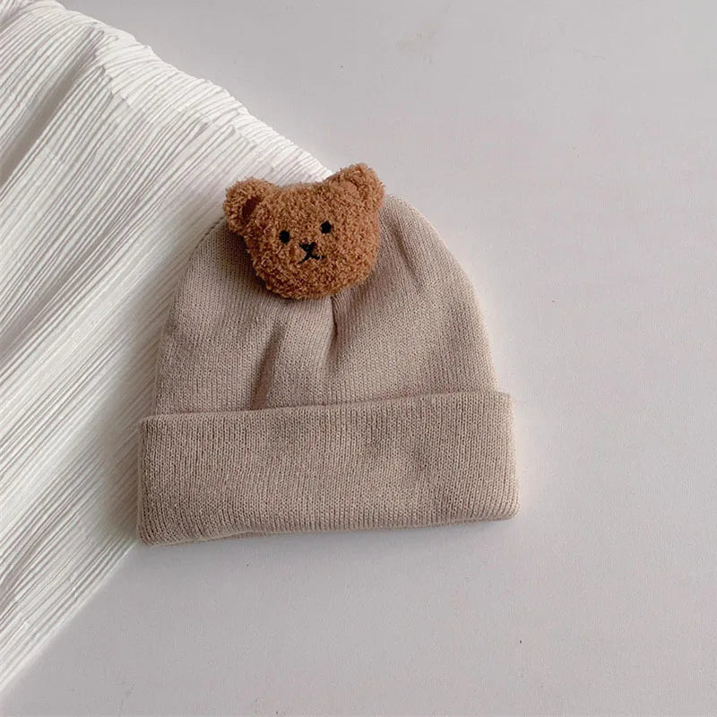 High-quality knitted warm baby hat, unisex design with cute bear detail, essential for cold