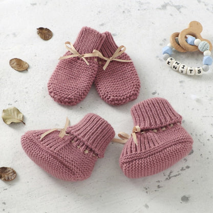 Detail of anti-slip sole on white knitted baby bootie, unisex infant accessory, soft and comfortable