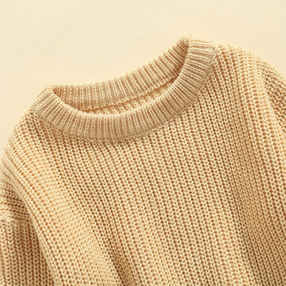 Unisex baby knitted sweater in a soft beige color, comfortable winter pullover for kids