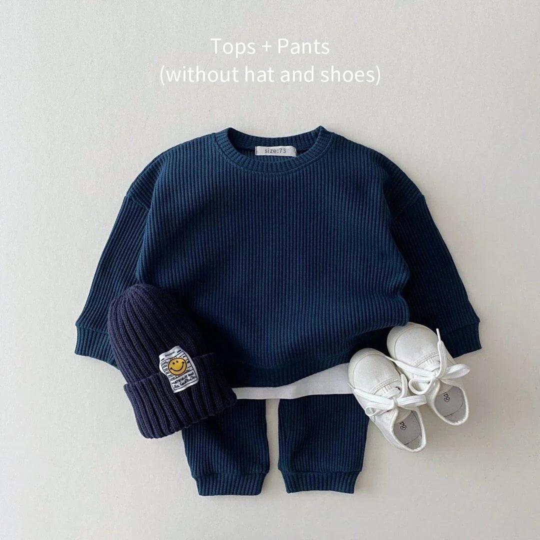 👶 Group of unisex baby cotton long sleeve bodysuits in various colors, baby basics