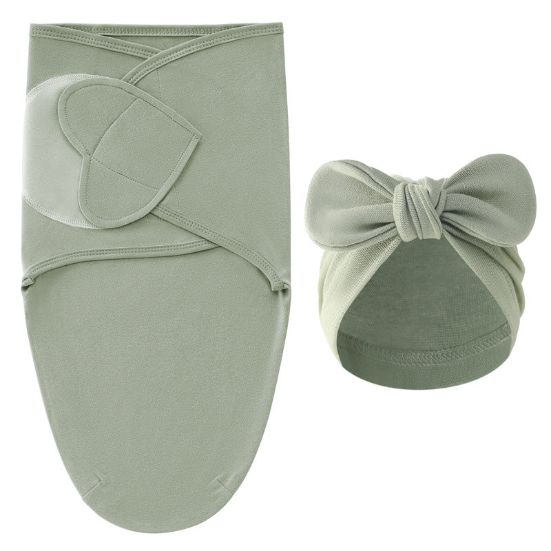Overhead shot of the cotton swaddle blanket and hat, ready for a newborn