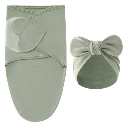Overhead shot of the cotton swaddle blanket and hat, ready for a newborn