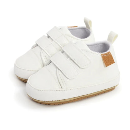 Infant footwear non-slip sneakers, showcasing breathable fabric texture
