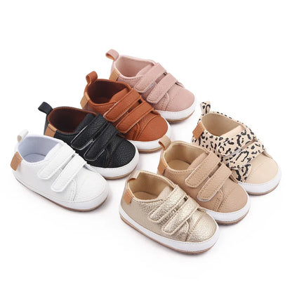 Side view of infant footwear, non-slip, with adjustable hook and loop
