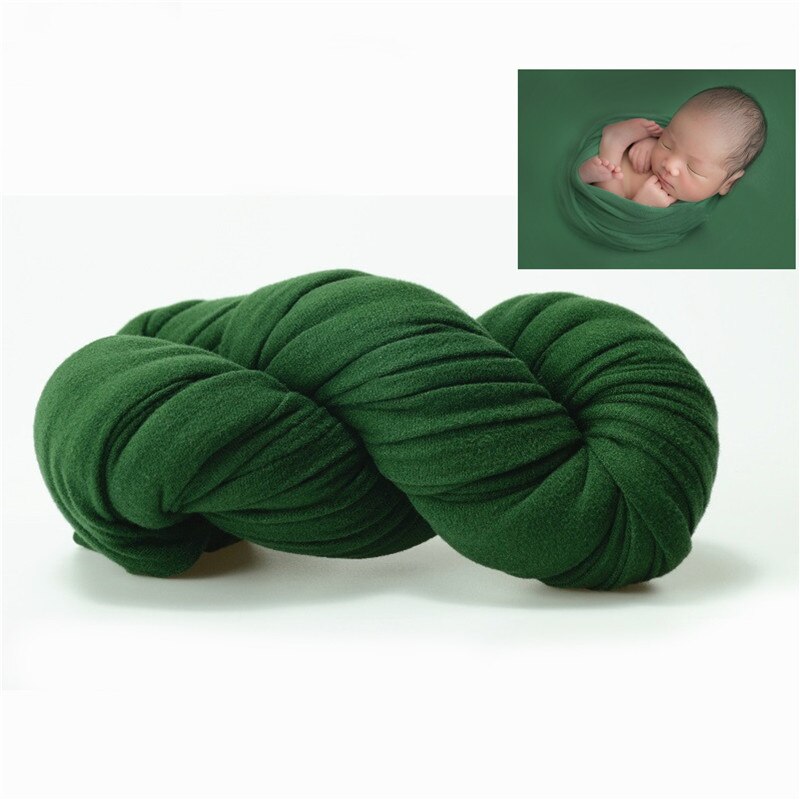 Newborn in a cozy baby blanket, perfect for a serene photo shoot setup