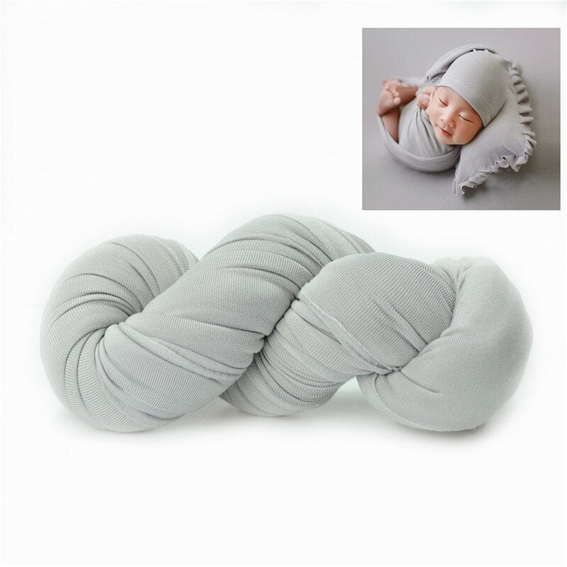 Newborn photo prop: stretchable baby blanket in a neutral color, ideal for infant swaddling