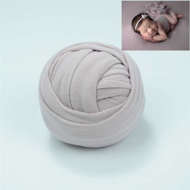 Soft white unisex baby wrap blanket for newborn photo shoots, comfortable cotton blend