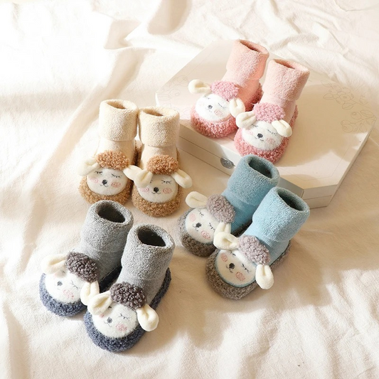 Unisex baby plush anti-slip cartoon shoes with soft sole, perfect infant booties for warmth.