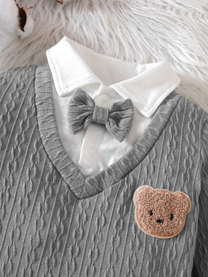Close-up of a unisex baby polo neck long sleeve romper, showing fabric detail and buttons