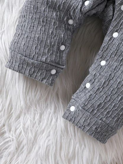 Unisex baby polo neck long sleeve romper folded neatly, showcasing its quality and design