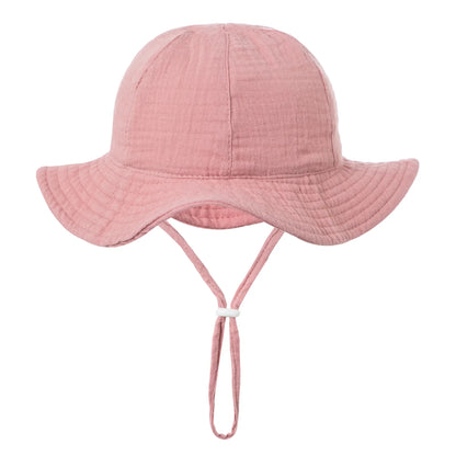 Unisex baby fashion accessory: durable cotton bucket hat with a vibrant jungle print, 3 to 12 months