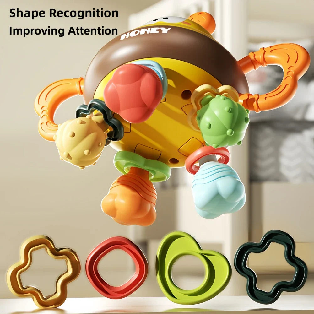 Handheld baby teether and rattle toy, an engaging and safe play item for babies and toddlers.
