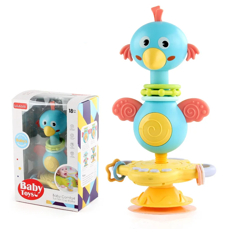 Infant grasping a sensory suction cup rattle, designed for safe and engaging play