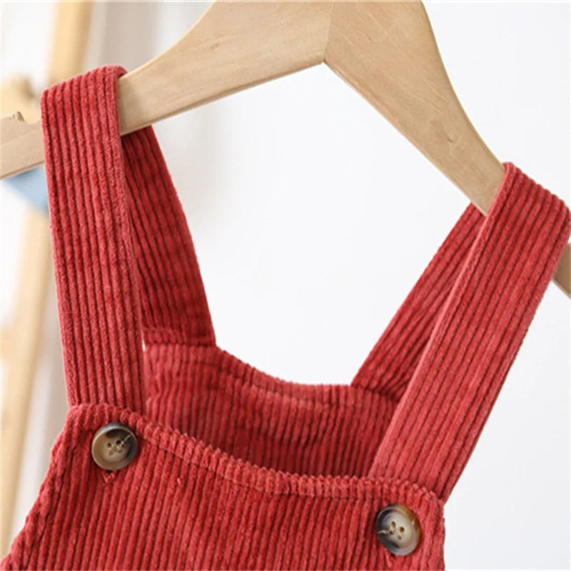 Front view of ivory unisex baby ribbed fabric overalls, a versatile infant clothing staple.
