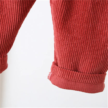 Unisex ribbed overalls paired with a long-sleeve onesie, showing a complete baby outfit.