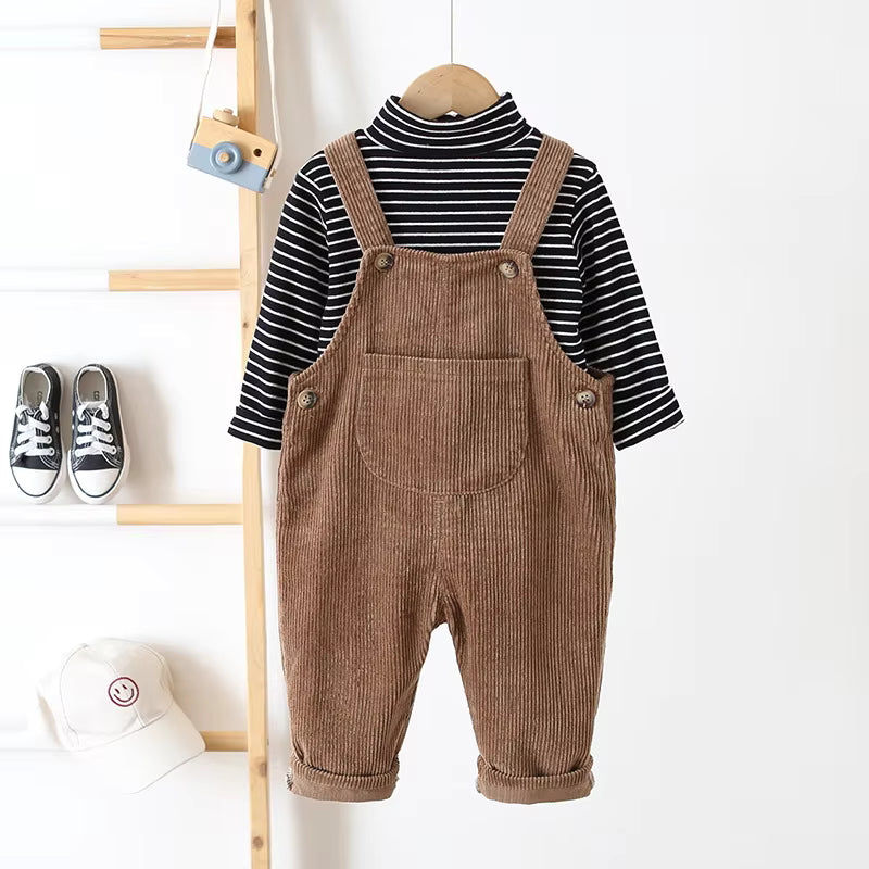 Folded unisex baby ribbed overalls, showcasing the soft cotton blend and quality craftsmanship.