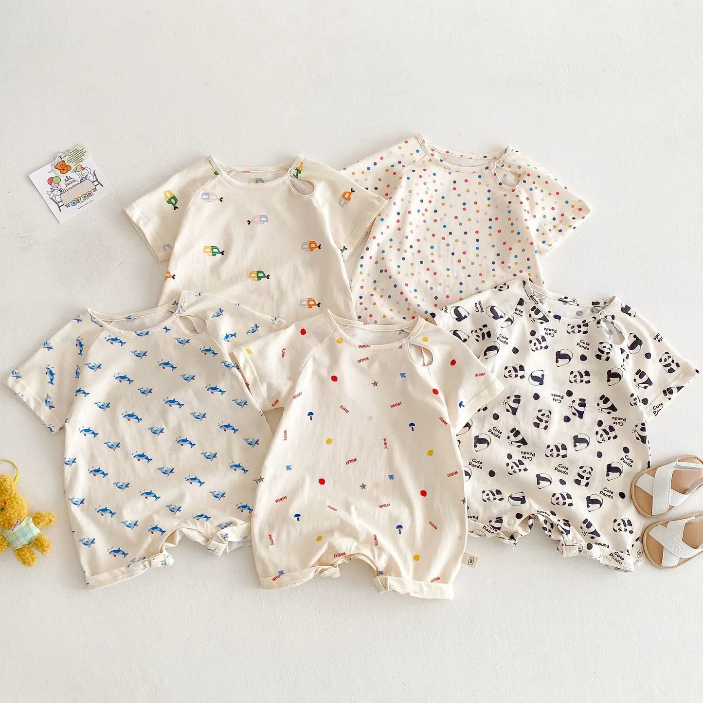 Unisex baby romper with a playful submarine print, featuring snap closures for easy diaper changes.