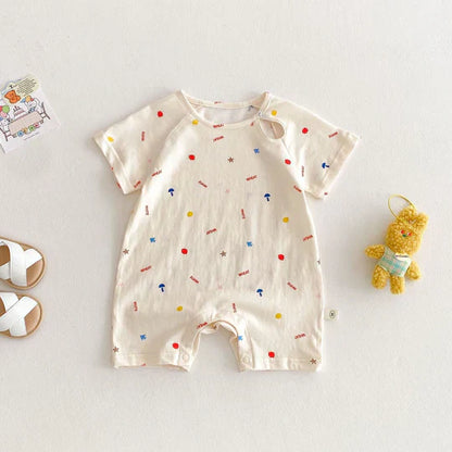 Close-up view of the soft, breathable fabric used in a unisex baby romper with a charming dot pattern.