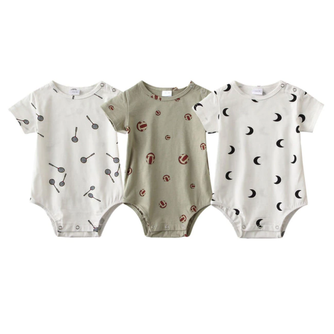 Close-up of a soft cotton baby romper with whimsical animal print, part of a 3-pack unisex set