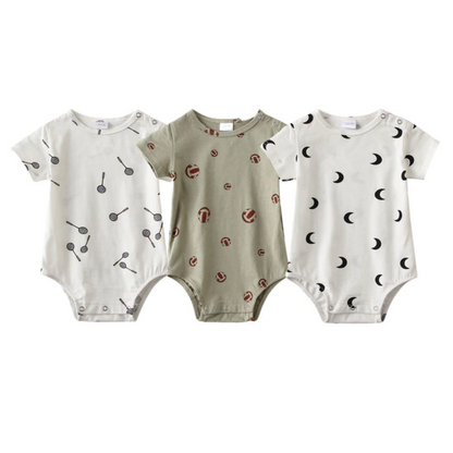 Close-up of a soft cotton baby romper with whimsical animal print, part of a 3-pack unisex set