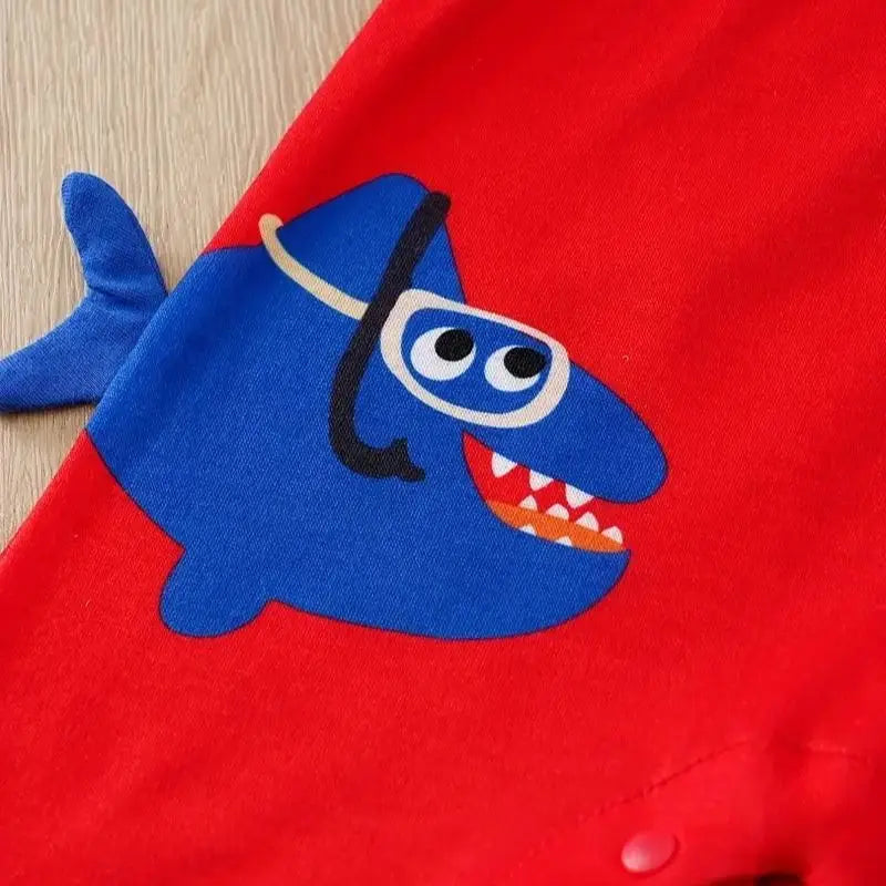 Toddler modeling blue Baby Shark short-sleeve romper, perfect unisex summer baby outfit