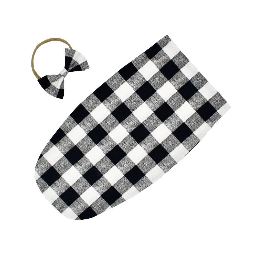 Cotton blend baby sleeping bag and headband, providing warmth and comfort for little ones.