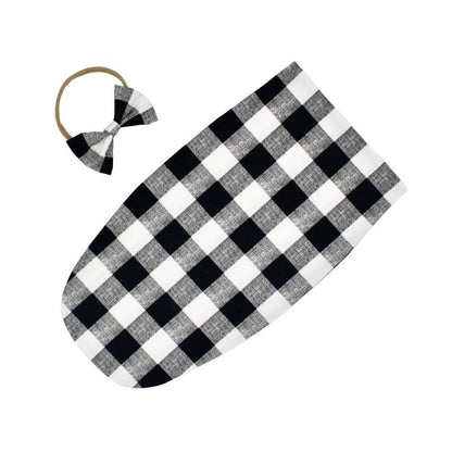 Cotton blend baby sleeping bag and headband, providing warmth and comfort for little ones.