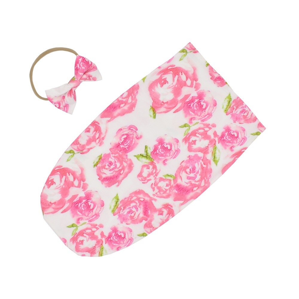 Unisex baby sleeping bag designed for safe sleep, includes a cute matching cotton headband.