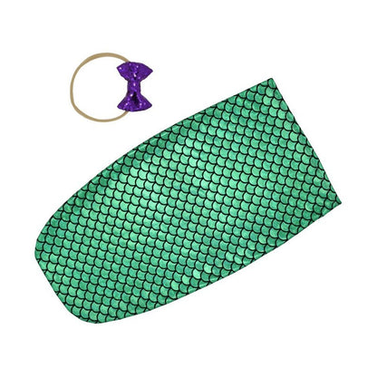 Soft infant swaddle sleep sack with coordinating baby headband, perfect for comfortable sleep.