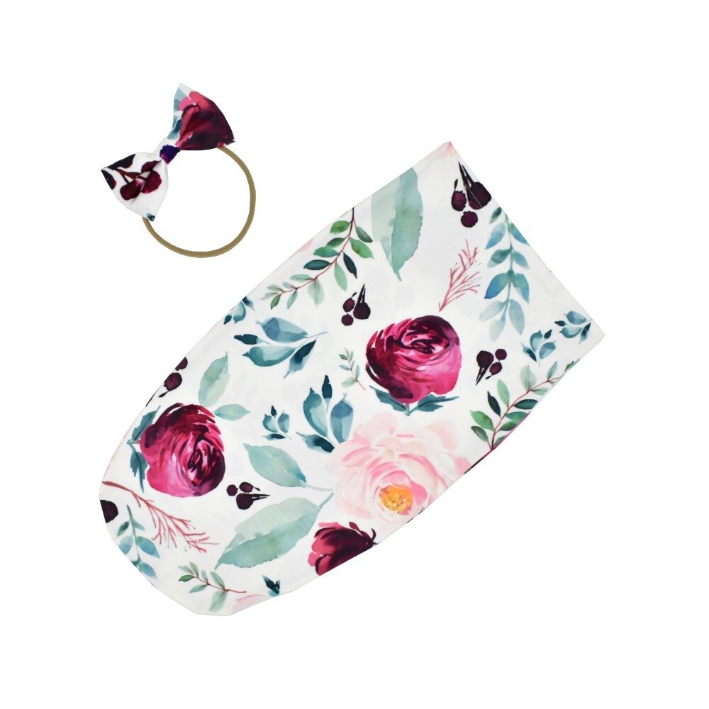 Unisex baby swaddle set featuring a gentle sleeping bag and stretchy headband for infants.