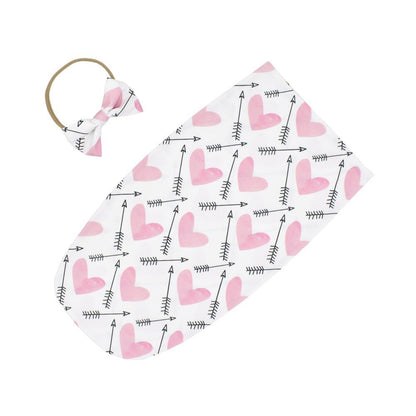 Baby sleeping bag and headband set, showcasing a practical design for easy swaddling.