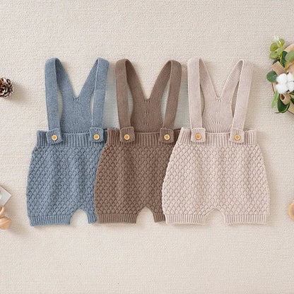 Unisex baby sleeveless knit romper in a light color, perfect for summer playtime.