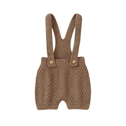 Soft acrylic knit infant sunsuit in a gender-neutral shade, ideal for warm weather.