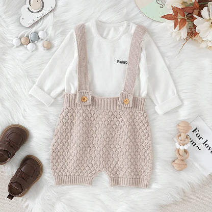 Close-up of a knitted baby romper texture, showcasing the soft acrylic fabric.